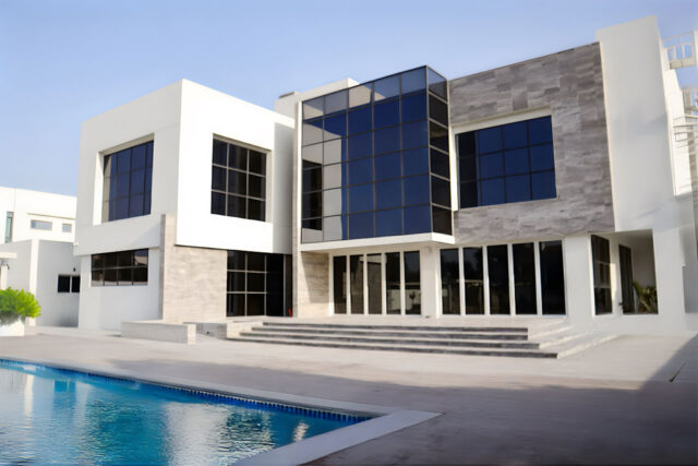 Nad Al Sheba Dubai villa community aerial view with modern homes and greenery.